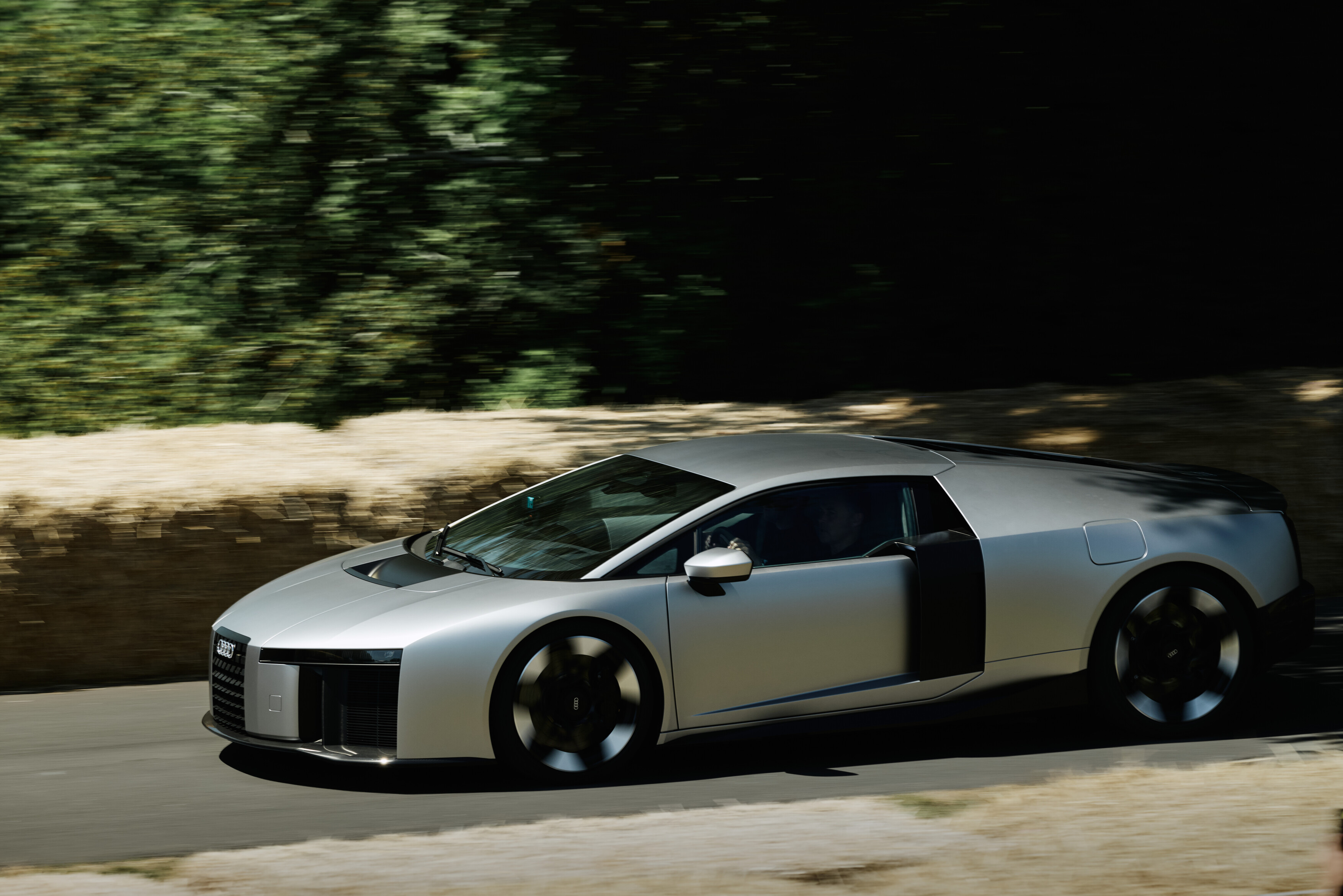 Racing legend Tom Kristensen races Audi Nuvolari up the 1.86-kilometer Hillclimb in the grounds of Goodwood House. The Nuvolari is the fastest and most powerful production vehicle in the brand’s history — and the first to follow Audi’s new design philosophy.