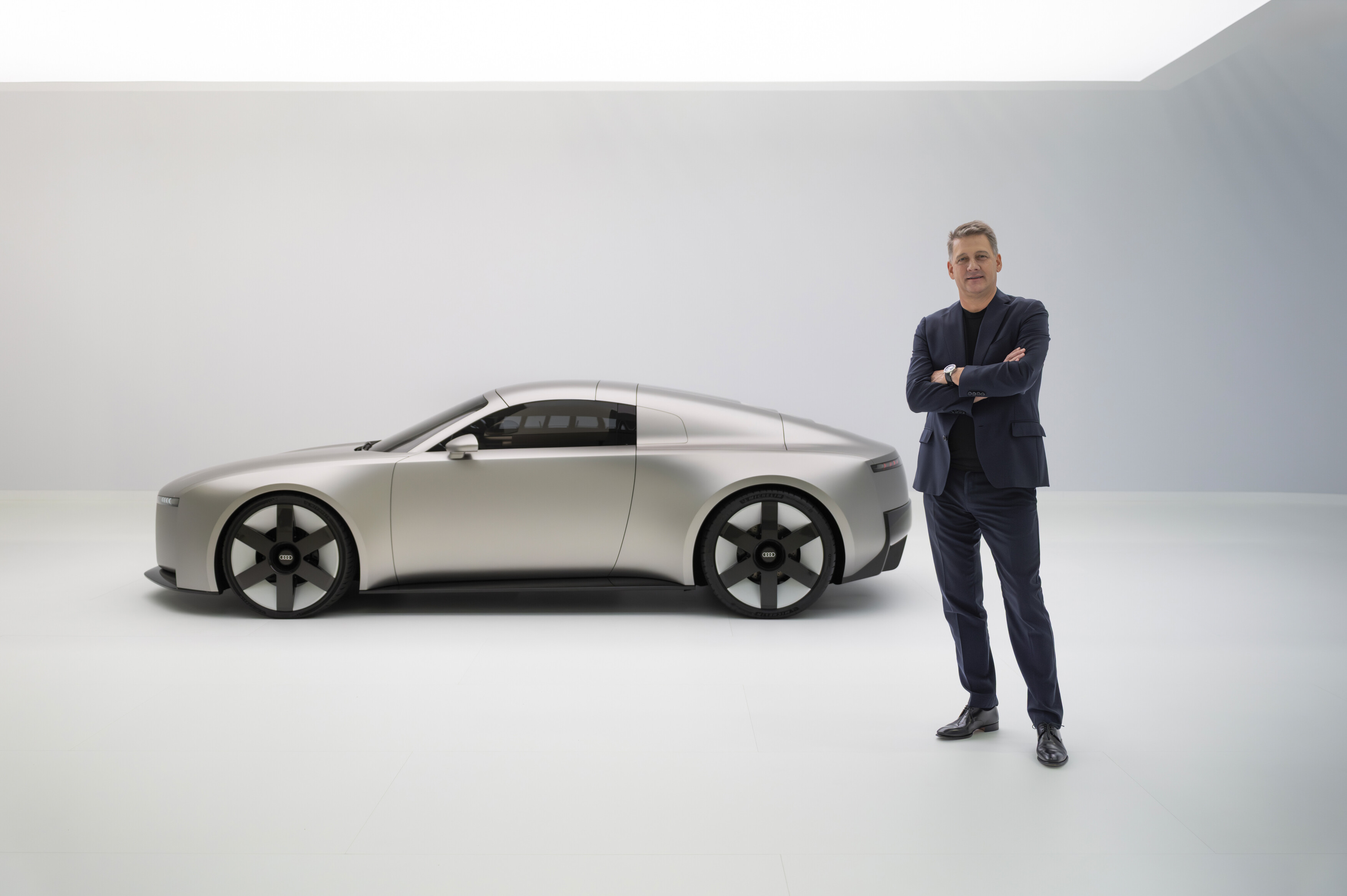 Audi Concept C Audi CEO Gernot Döllner to the right of the Audi Concept C